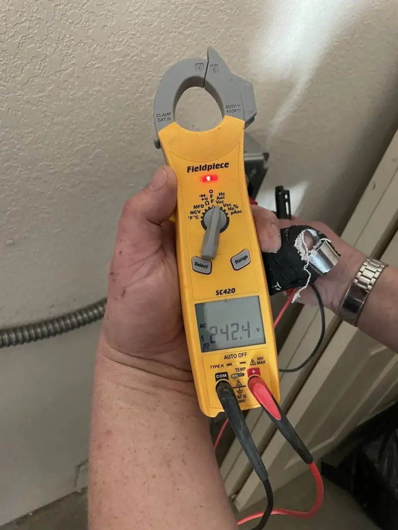 Voltage testing with clamp meter during Whole House Surge Protector in Muttontown